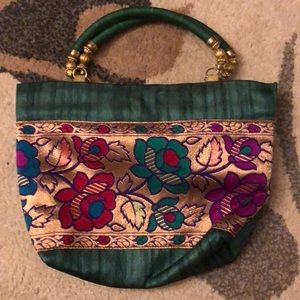 Green and gold handbag
